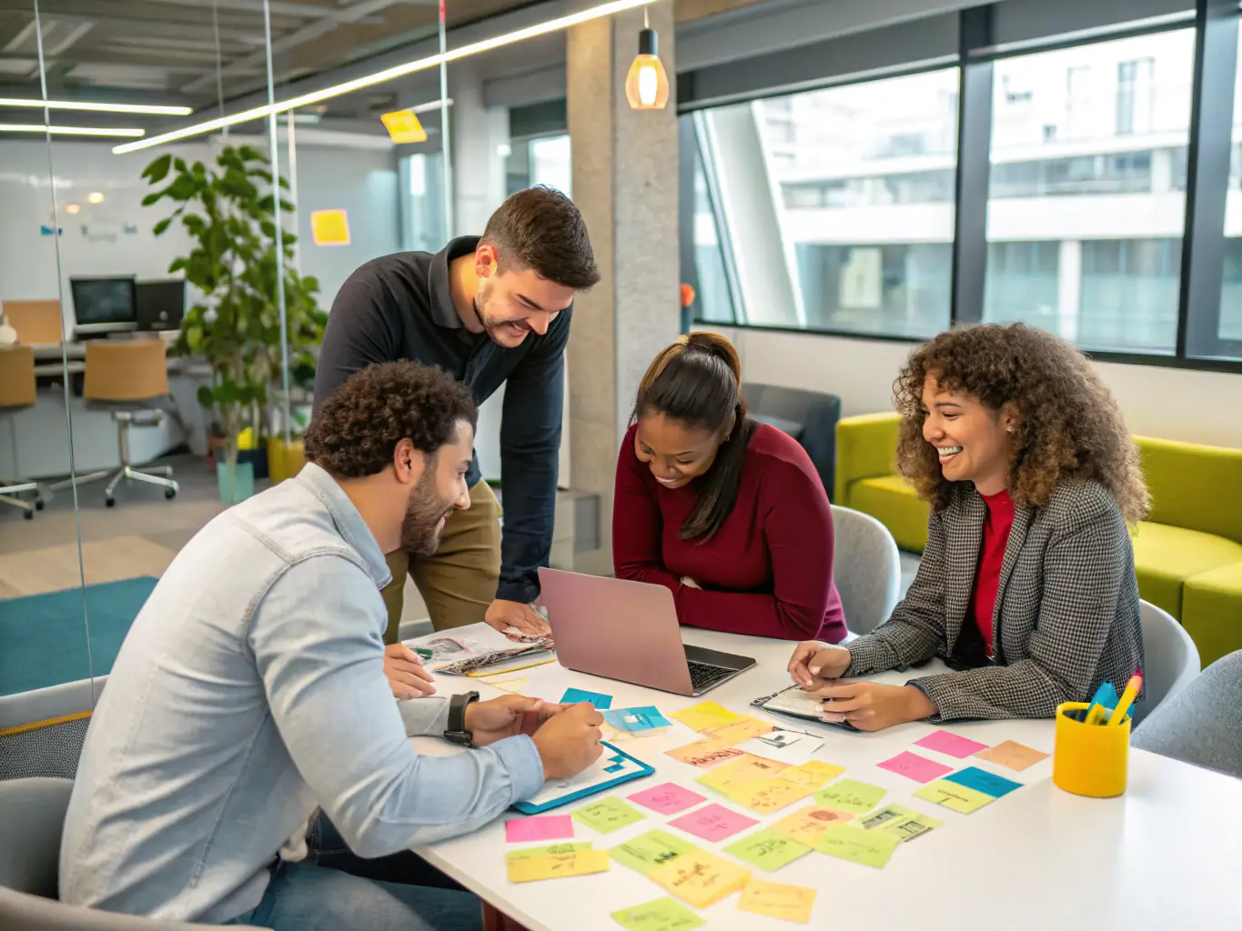 A dynamic image showcasing a diverse group of entrepreneurs brainstorming ideas in a modern office setting, symbolizing collaborative startup strategy development.